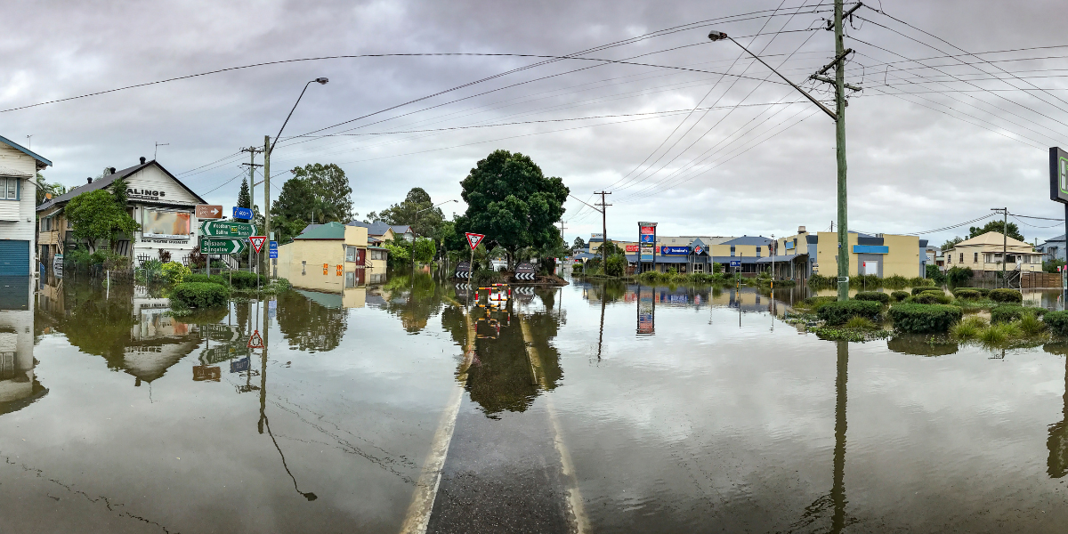 Flooded buildings and streets around a major intersection in Lismore, NSW, Australia.
